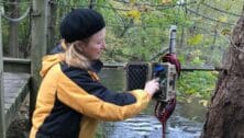 Volunteer Carol Armstrong does maintenance at Pickering Creek in Phoenixville.