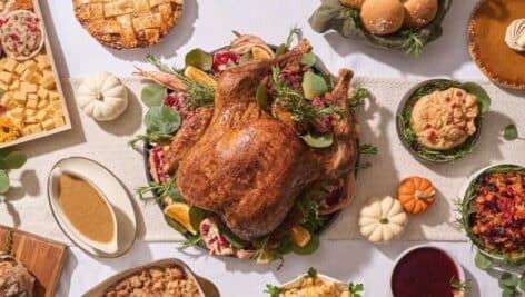 thanksgiving food spread out on table, aerial view