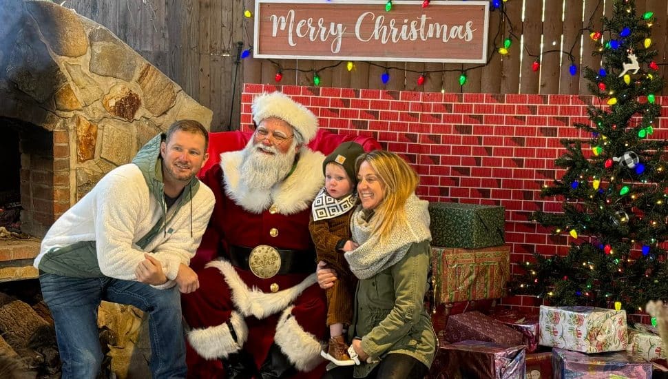 couple with small child meeting Santa