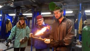 Welding teacher and students.