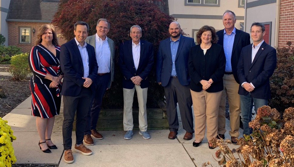 business professionals pose for a group photo