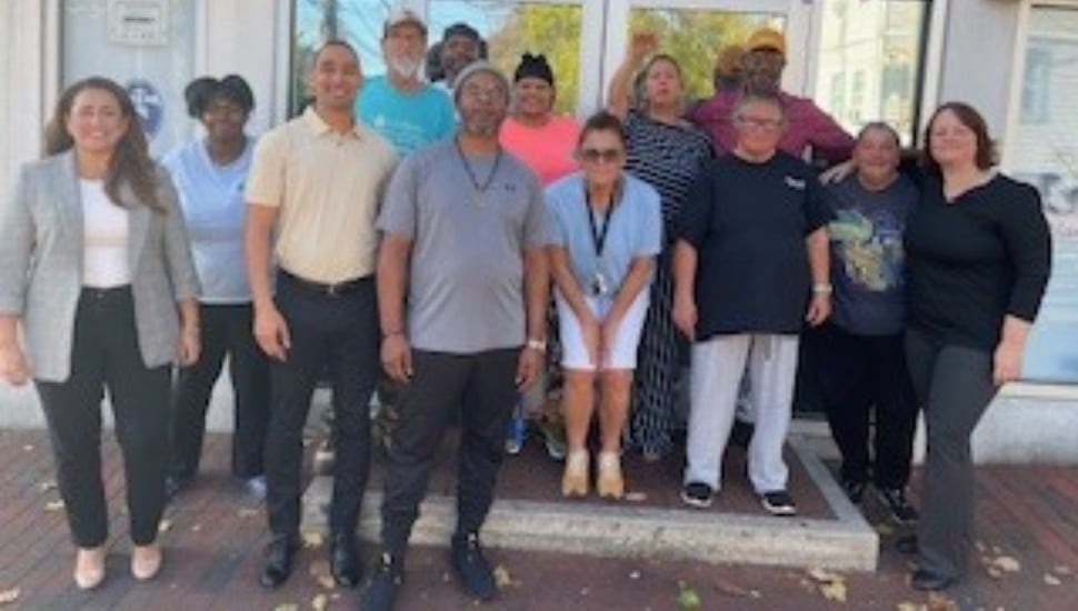 Staff and residents from Safe Harbor and Pamela Villagra, executive director of the Foxwynd.