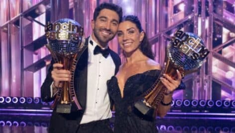 Joey Graziadei and Jenna Johnson hold their Mirrorball Trophies.