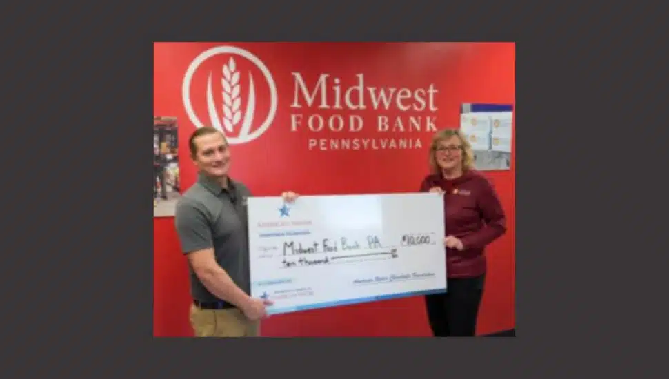 Pennsylvania American Water presents a $10,000 check to Midwest Food Bank Pennsylvania in support of efforts to end hunger.