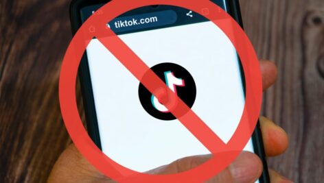 Graphic of TikTok app being banned on phone.