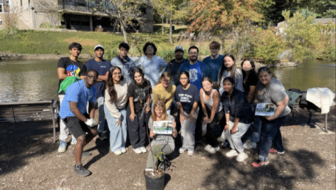 Students at Penn State Abington (gathered in group) who participated in planting trees on campus.