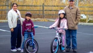 A family tests out their bikes during the Giving Bikes Back distribution event at the Jennersville YMCA on Dec. 7, 2024.