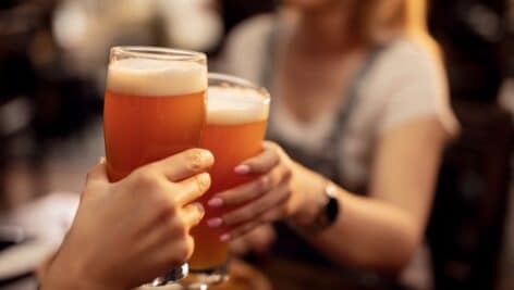 couple cheering with drinks