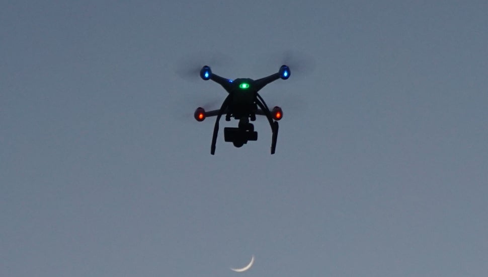 Drone in sky at evening time.