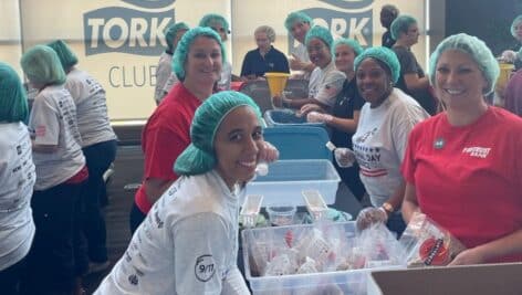 volunteers pack meals