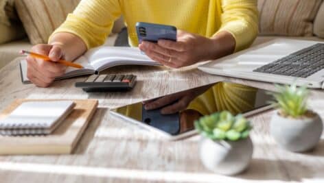 Woman Setting Financial Goals at Home, Organizing Her Finances and Controlling Daily Expenses.