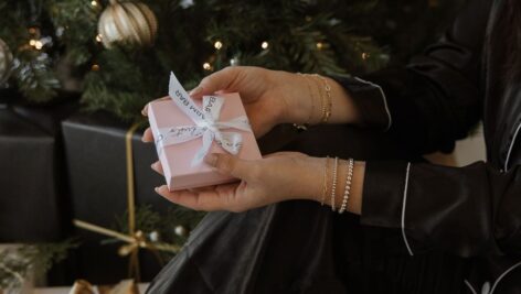 woman holding small gift