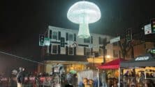 Giant glowing mushroom hanging in the air for Midnight in the Square.