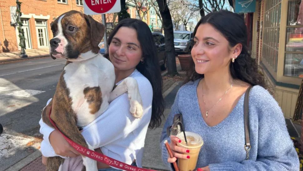 Lili Basciani walks with Roxy in her arms next to her sister.