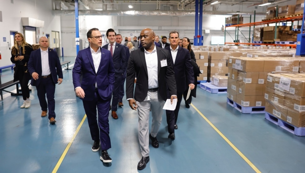 Josh Shapiro walking with group of people.