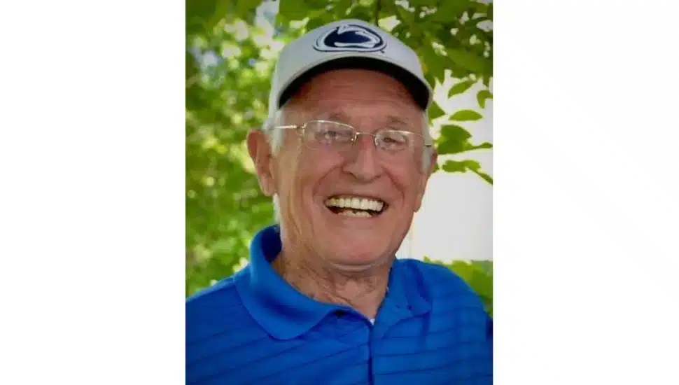 Arnie Kring in hat and glasses.