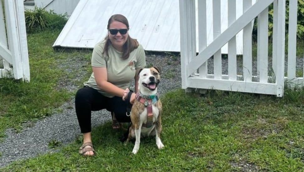Becky S. is shown with her dog Ellie.