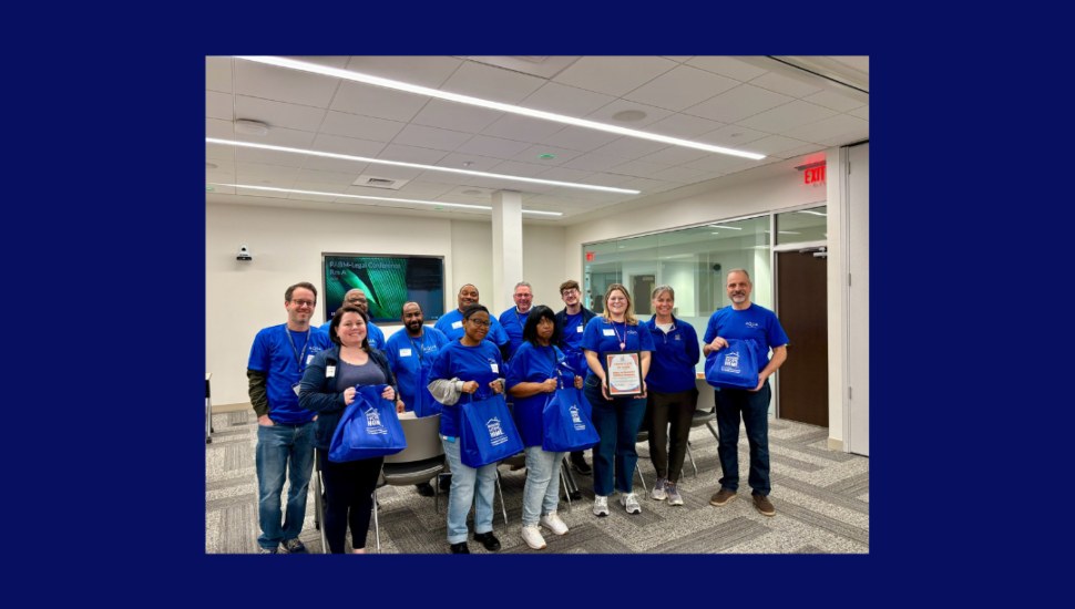 A group photo showing Aqua Pennsylvania President Marc Lucca (far right), who joined the Bags of Hope volunteer event alongside members of the Black Employee Resource Group.