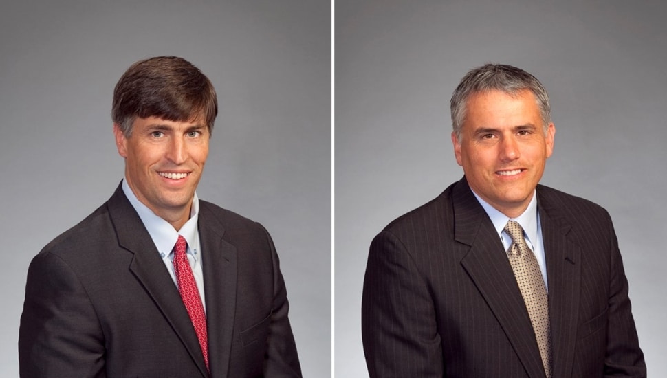 Headshots of two business executives.