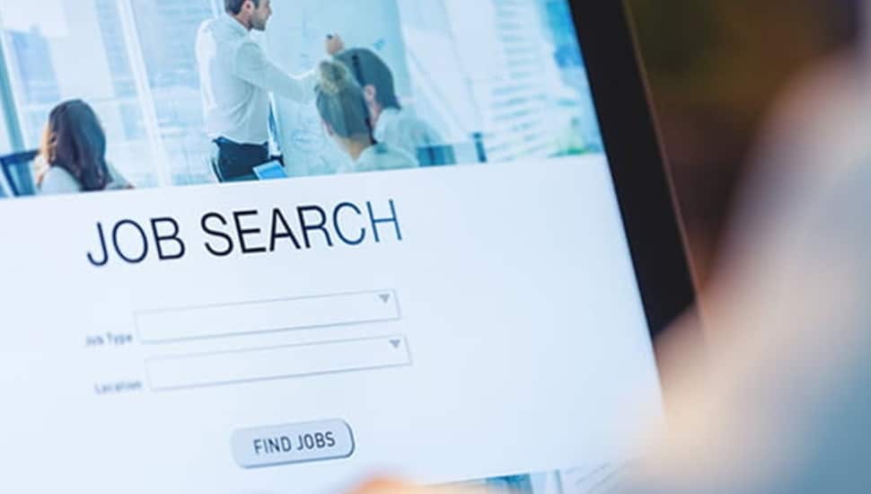 Person searches for a job on computer.
