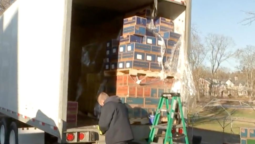 Truck full of Girl Scout Cookies boxes.