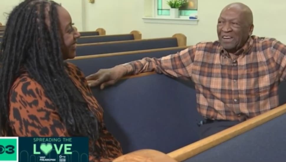 Robert Ferguson in church pews with woman.