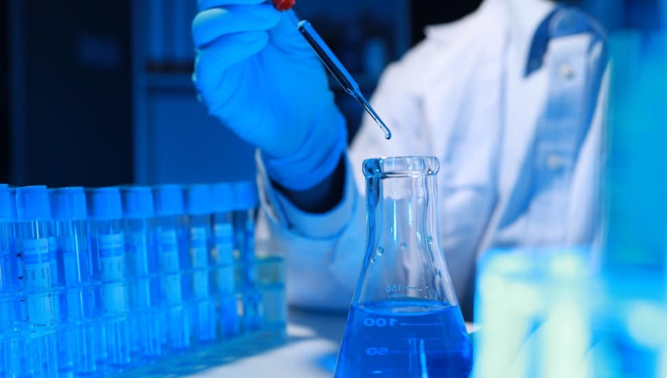 Scientist with test tube.
