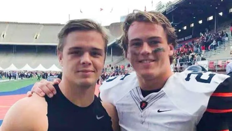 Tiger Bech (left) and Ryan Quigley (right) pose for a photo.