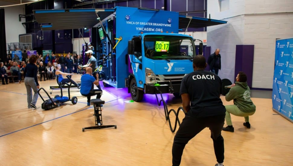 YGBW Wellness staff demonstrate fitness equipment on the Fit Truk.