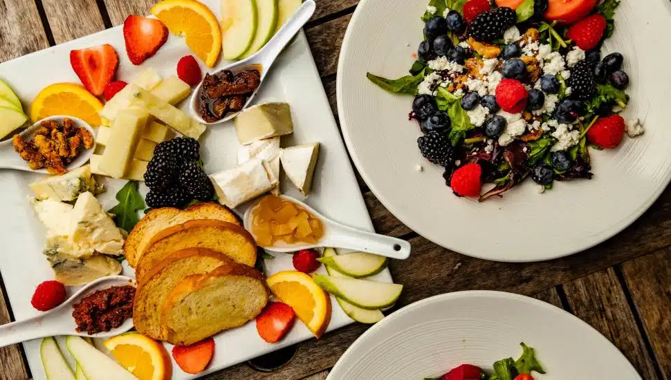 Plates of salads and other food.