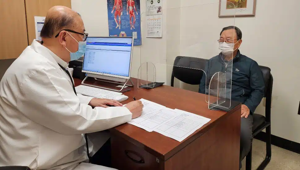 Doctor discusses treatment options with patient.