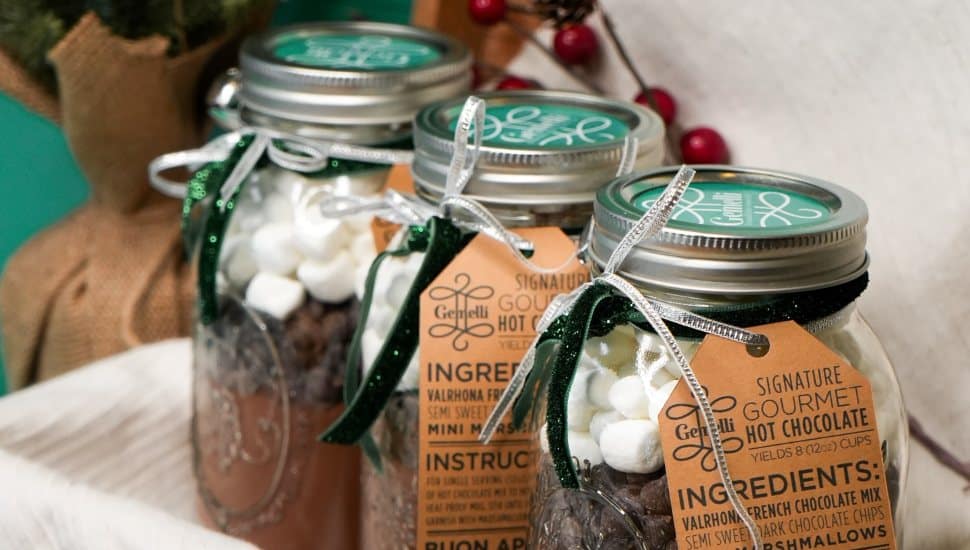Mason jars with gourmet hot chocolate ingredients.