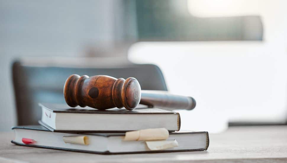 Gavel on top of bunch of books.