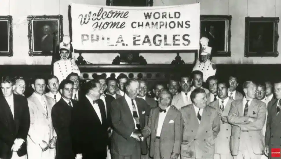 1960 Eagles team gathering for photo after win.