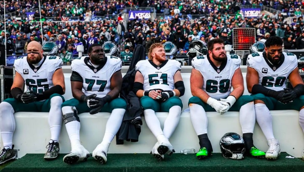 Eagles offensive line on the bench.
