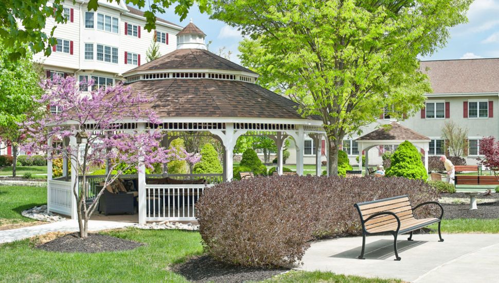 A gazebo and the outside of Freedom Village at Brandywine.