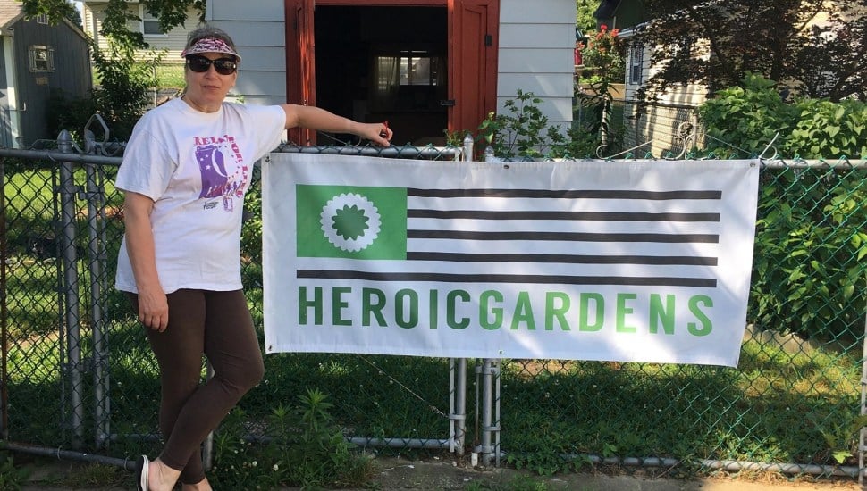 Woman standing outside garden.