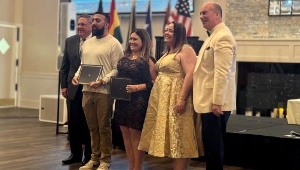 Students receive scholarship awards.