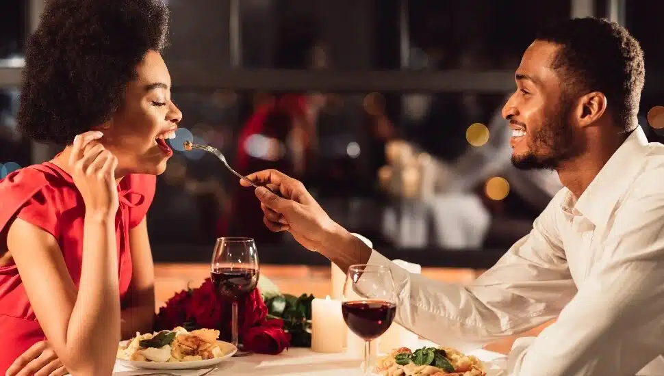 Man Feeding Girlfriend During Dinner