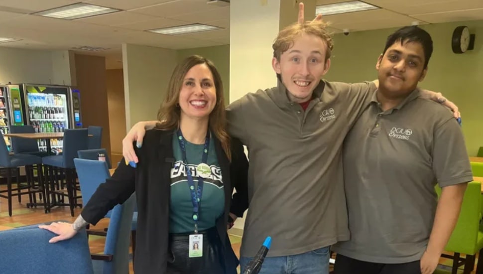 Two students and a teacher.