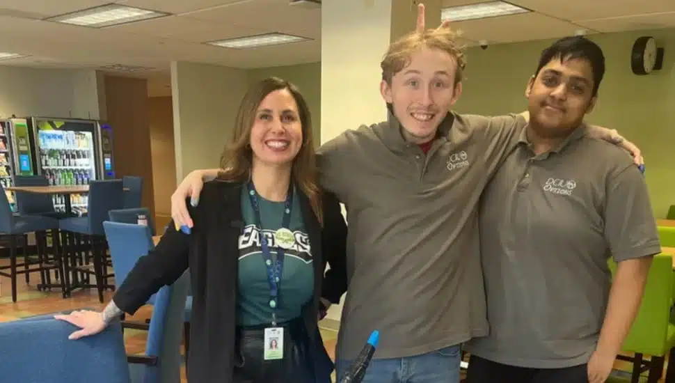Two students and a teacher.