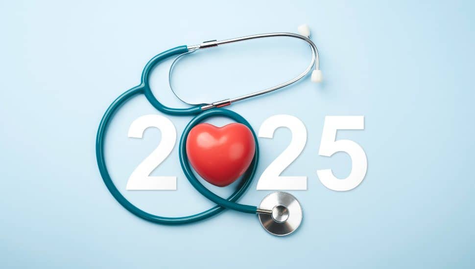 A stethoscope forming a heart shape over the year 2025.