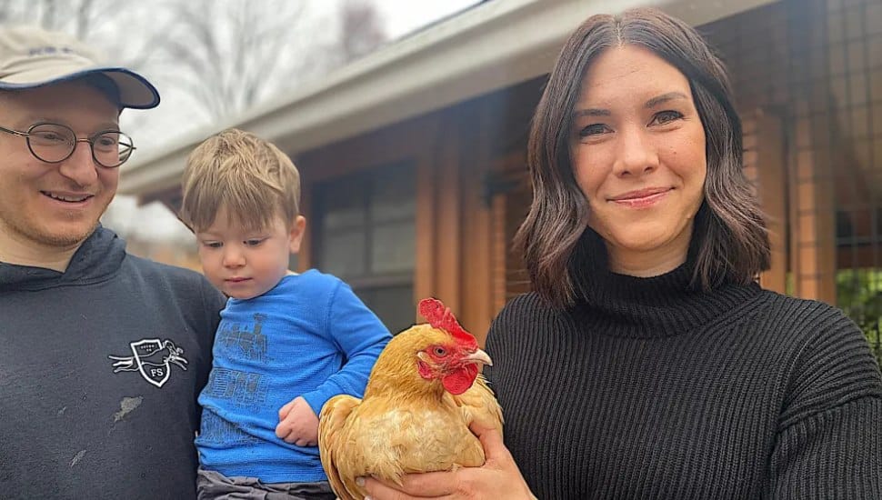 Brian, Theodore and Katie Madonna with Lucy the chicken.