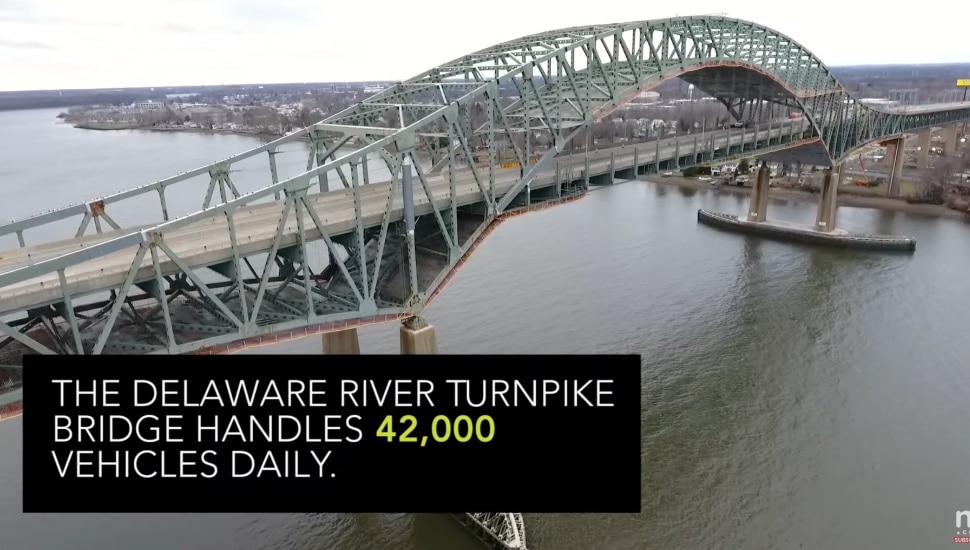 Delaware River Bridge from the side with cars traveling.