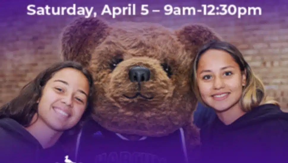 Two smiling students pose with a person in a bear mascot costume at Harcum College’s Spring Open House event, scheduled for Saturday, Apr. 5, from 9:00 AM-12:30 PM.
