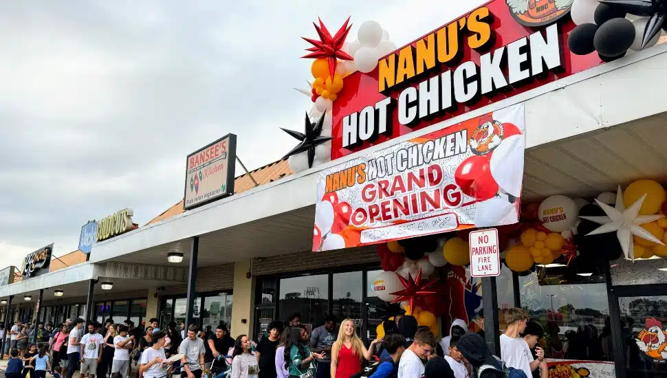 People standing in line outside of Nanu's Hot Chicken.