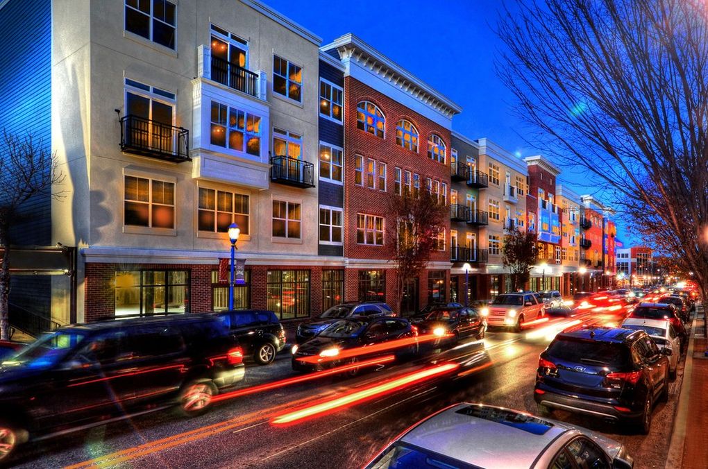 Phoenixville street at night with cars.