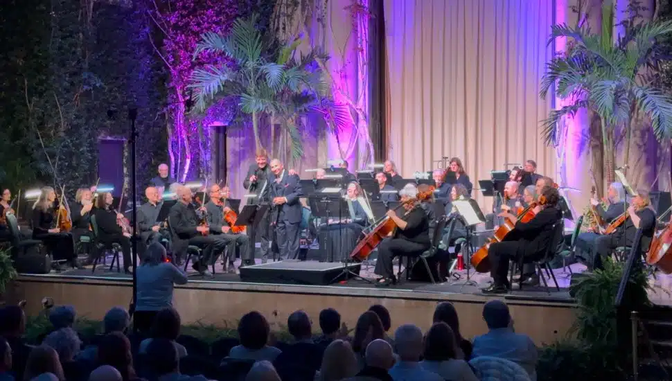 The Kennett Symphony performs on stage with a full audience.