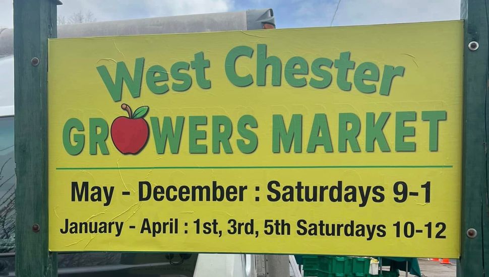Yellow West Chester Growers Market sign.