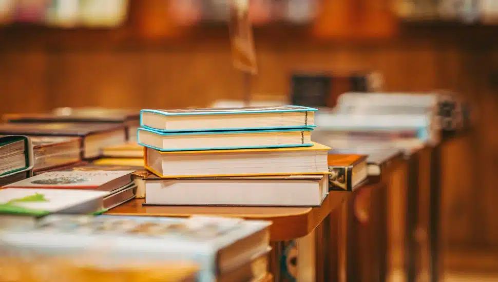 Stack of books on display in library.